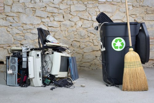 Builders loading waste into a skip